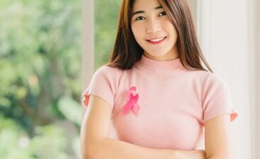 woman with pink ribbon on chest