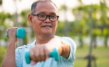 Elderly man excercise with dumbbells